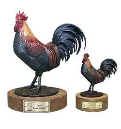 picture of the Championship trophy  “Reveille” the spirited rooster sculpted and handcrafted by Malcolm DeMille.
