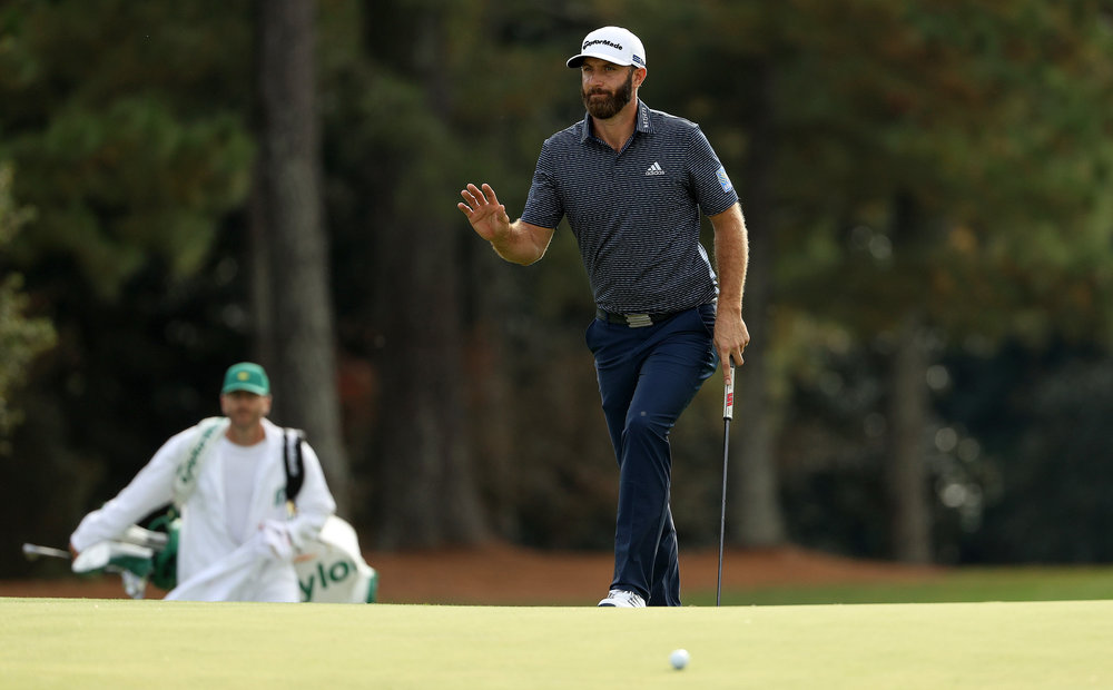 Dustin Johnson of the United States waves as he walks to the 18th green during the final round of the Masters at Augusta National Golf Club on November 15, 2020 in Augusta, Georgia. 