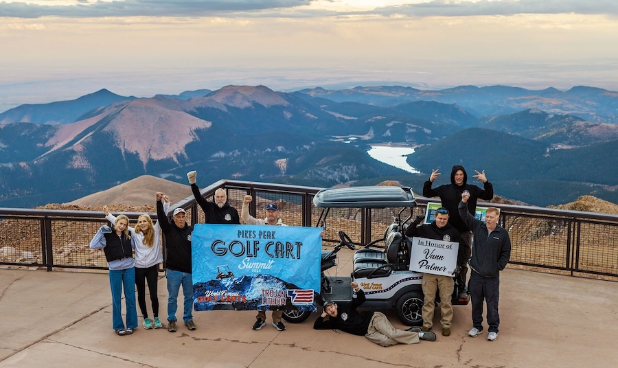 Team picture atop Pikes Peak following the The Trojan Lithium OnePack powered a golf cart driven by Austin King, owner of World Famous Golf Carts, to the summit of Pikes Peak.