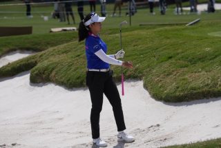 Jeeno Thitikul hitting golf ball out of sand bunker