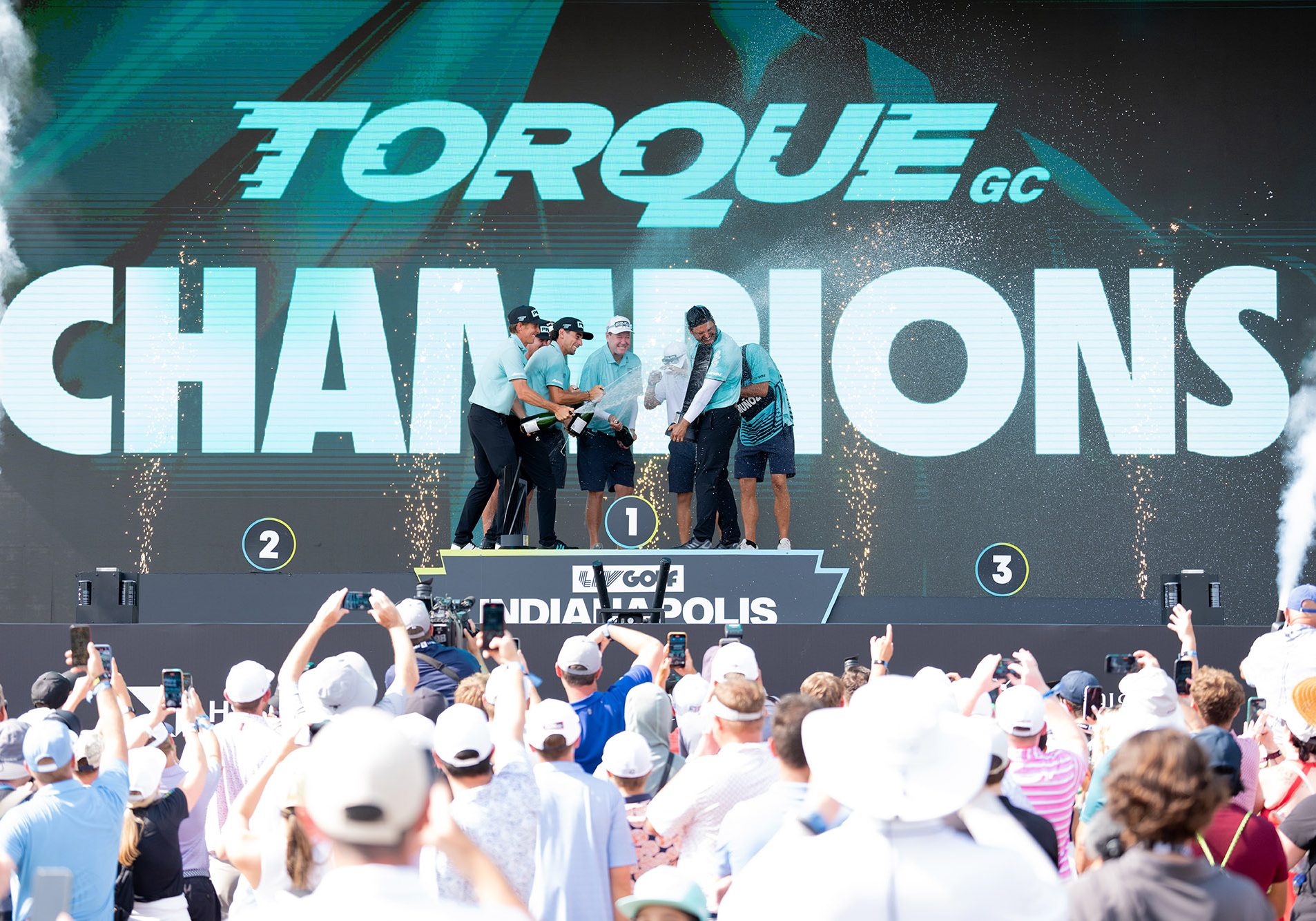 First place team champions, Captain Joaquín Niemann, Mito Pereira, Carlos Ortiz, and Sebastián Muñoz of Torque GC celebrate on the podium following the final round of LIV Golf Indianapolis at The Club at Chatham Hills on Sunday, August 17, 2025 in Westfield, Indiana. (Photo by Mateo Villalba/LIV Golf)
